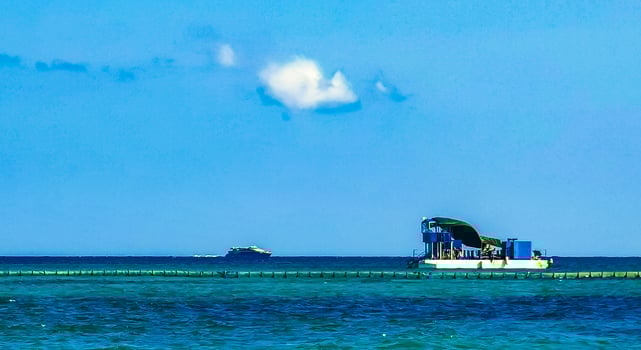 Boats yachts ship catamaran jetty beach Playa del Carmen Mexico. photo