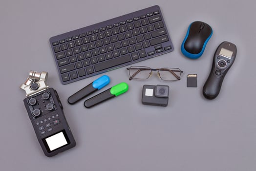 Top View of Video Blogger's Workplace. Digital Gadgets Lying on Grey Table Flat Lay photo