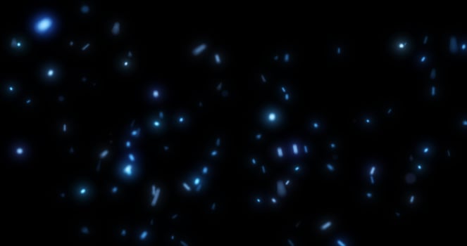 Abstract bright background of flying blue glowing light fire sparks from a fire on a black background photo