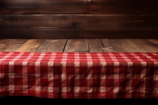 AI generated A Red Checkered Tablecloth on a Wooden Table, Set against a Wooden Background photo