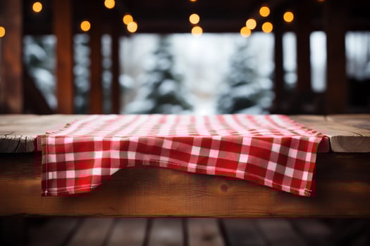 AI generated A Red Checkered Tablecloth on a Wooden Table, Set against a Wooden Background photo