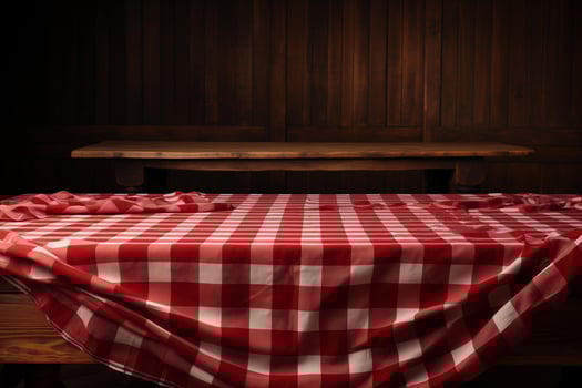 AI generated A Red Checkered Tablecloth on a Wooden Table, Set against a Wooden Background photo