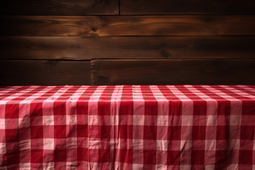 AI generated A Red Checkered Tablecloth on a Wooden Table, Set against a Wooden Background photo
