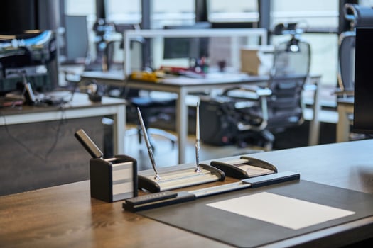 Modern office work place in large corporation. Comfortable work table with stationery, leather computer chair. Boss, chief, supervisor or head of company working place. photo