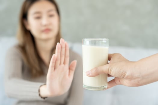 Milk allergens, Sick sad unhealthy ill allergic woman, runny stuffy sore nose suffer from intolerance allergy trigger symptoms. abdominal pain, allergens, nut protein, rash, death, food allergy photo