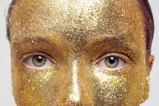 Magic Girl Portrait in Gold. Golden Makeup photo