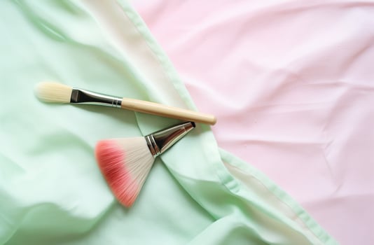 AI generated a pink brush, pencil, brushes and watercolors laying on a white surface photo