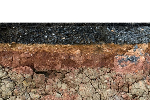 The layer of asphalt road with soil and rock. photo