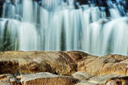 Small waterfall and stone with water motion. photo
