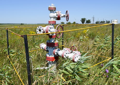 Well for oil and gas production. Oil well wellhead equipment. Oil production photo