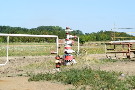 Well for oil and gas production. Oil well wellhead equipment. Oil production photo