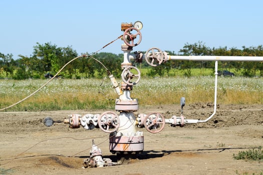 Well for oil and gas production. Oil well wellhead equipment. Oil production photo