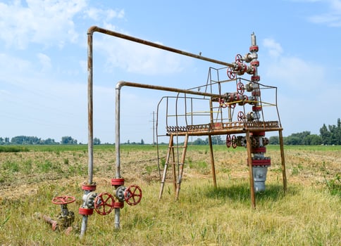 Well for oil and gas production. Oil well wellhead equipment. Oil production photo