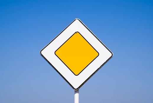 Road signs, the main road. Sign on a blue background photo