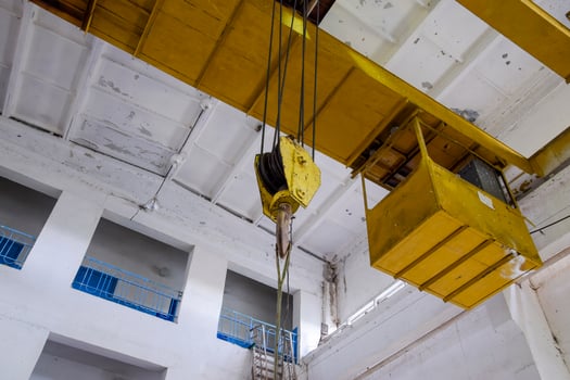 Hoist with winch and hook. A tool for moving goods in a producti photo