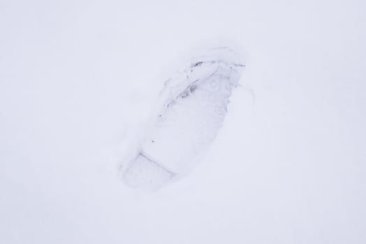 Human footprints in the snow. The path in the snow photo