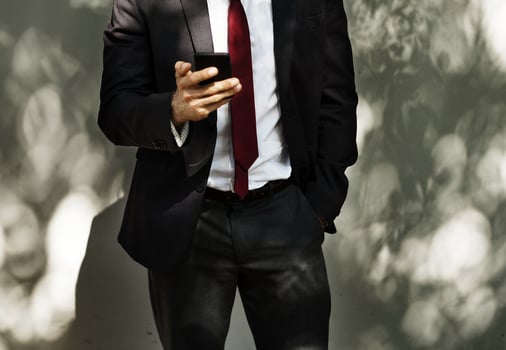 A man looking at his mobile phone photo