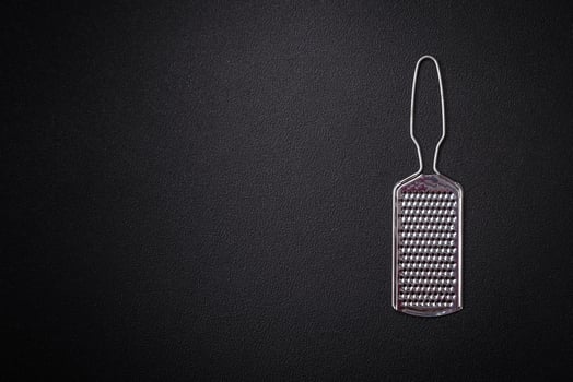Beautiful small metal kitchen grater with handle photo