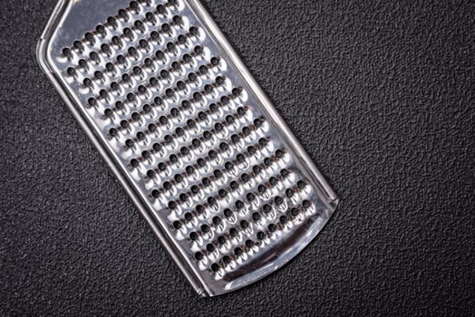 Beautiful small metal kitchen grater with handle photo