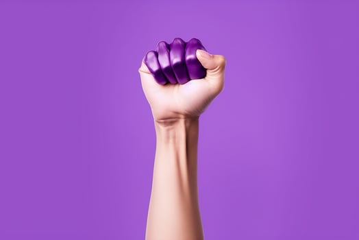 AI generated Raised purple fist of a woman for international women day and the feminist movement march 8 for feminism photo