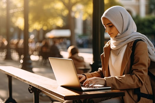 AI generated Muslim woman in hijab working on laptop photo