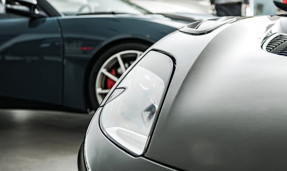 Brand New Luxury Cars Inside a Dealership Showroom photo