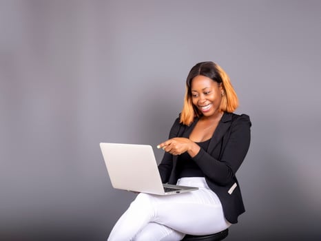 beautiful African lady using her laptop photo