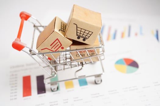 Online shopping, Shopping cart box on business graph, import export, finance commerce. photo