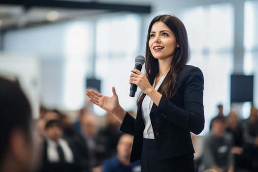 AI generated Female speaker giving a talk on corporate business conference. Unrecognizable people in audience at conference hall. Business and Entrepreneurship event photo