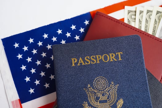 US passport on USA flag, American citizen in United States of America. photo