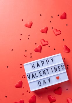 letter board with words Happy Valentines Day on red background photo