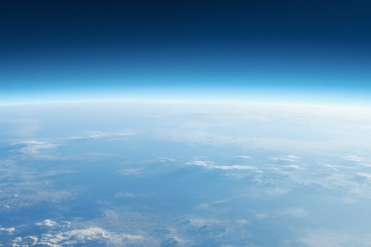 AI generated aerial view to the blue earth's surface with atmospheric haze and clouds photo