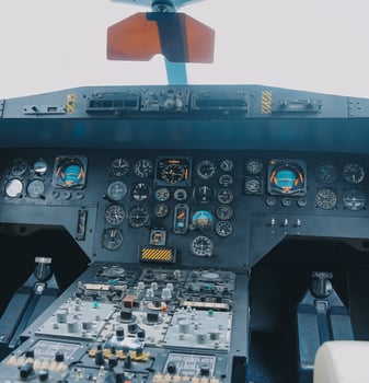 inside a big jet flying plane cockpit,flying above clouds photo