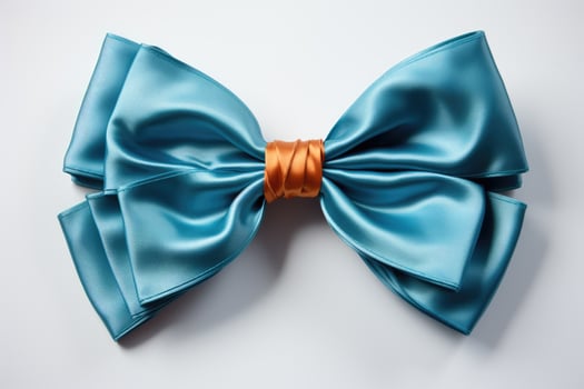 A blue satin bow with orange ribbon on it photo