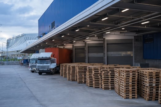 Truck is carrying container parking in front warehouse photo