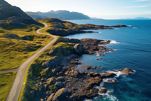 AI generated Aerial view of road, rocky sea coast with waves and stones at sunset Landscape with beautiful road, transparent blue water, rocks. Top view from drone of highway in summer photo