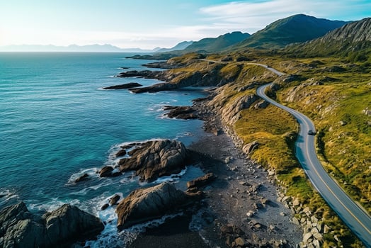 AI generated Aerial view of road, rocky sea coast with waves and stones at sunset Landscape with beautiful road, transparent blue water, rocks. Top view from drone of highway in summer photo