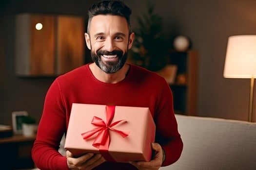 AI generated Man holding Christmas gift box at home. photo