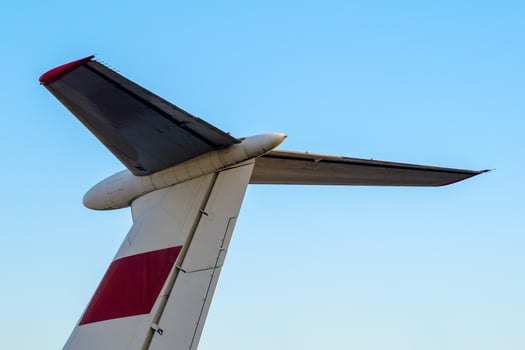 part tail of soviet airliner close up isolated photo