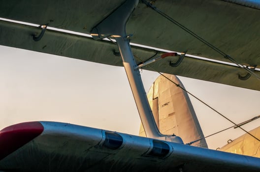 wings of an old airplane against a blue sky photo
