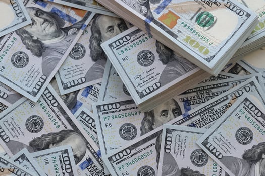 Very big amount of US hundred dollar bills. Huge quantity of united states currency notes on flat table photo