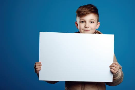 AI generated Little boy holding a blank white sheet of paper photo