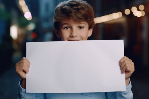 AI generated Little boy holding a blank white sheet of paper photo