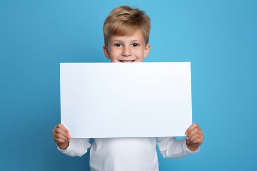 AI generated Little boy holding a blank white sheet of paper photo