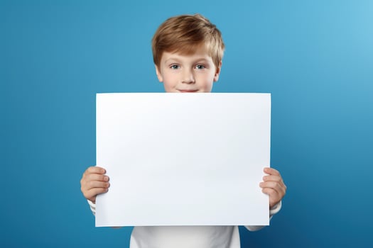AI generated Little boy holding a blank white sheet of paper photo