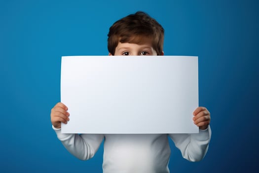 AI generated Little boy holding a blank white sheet of paper photo