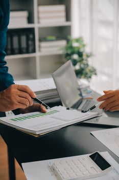 Financial Business team present. Business man hands hold documents with financial statistic stock photo, discussion, and analysis report data the charts and graphs. Finance Financial concept photo