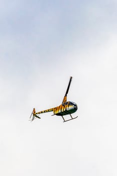 Playa del Carmen Quintana Roo Mexico 2022 Tourist helicopter flies over the Caribbean Sea in Mexico. photo