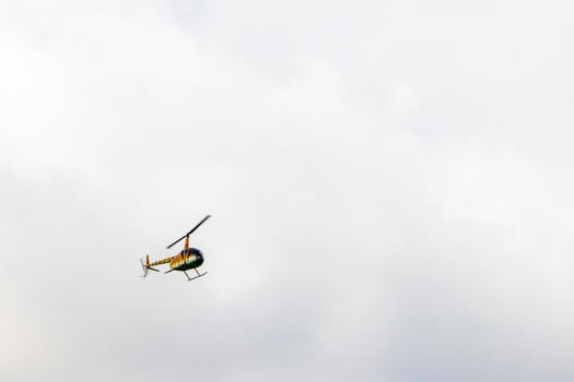 Tourist helicopter flies over the Caribbean Sea in Mexico. photo