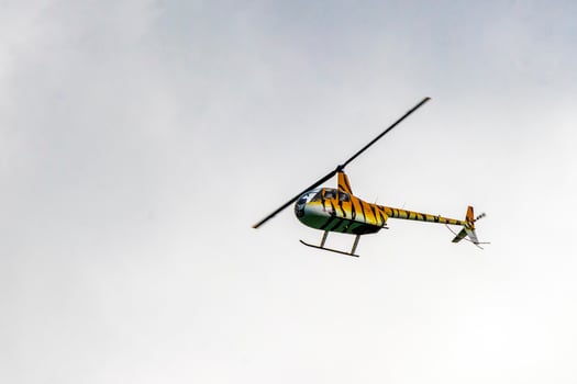 Playa del Carmen Quintana Roo Mexico 2022 Tourist helicopter flies over the Caribbean Sea in Mexico. photo